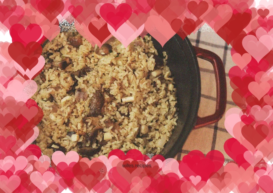 Mushroom rice cooking in a cast iron pot