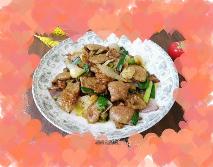 Stir-fried pork liver with garlic sprouts and onions