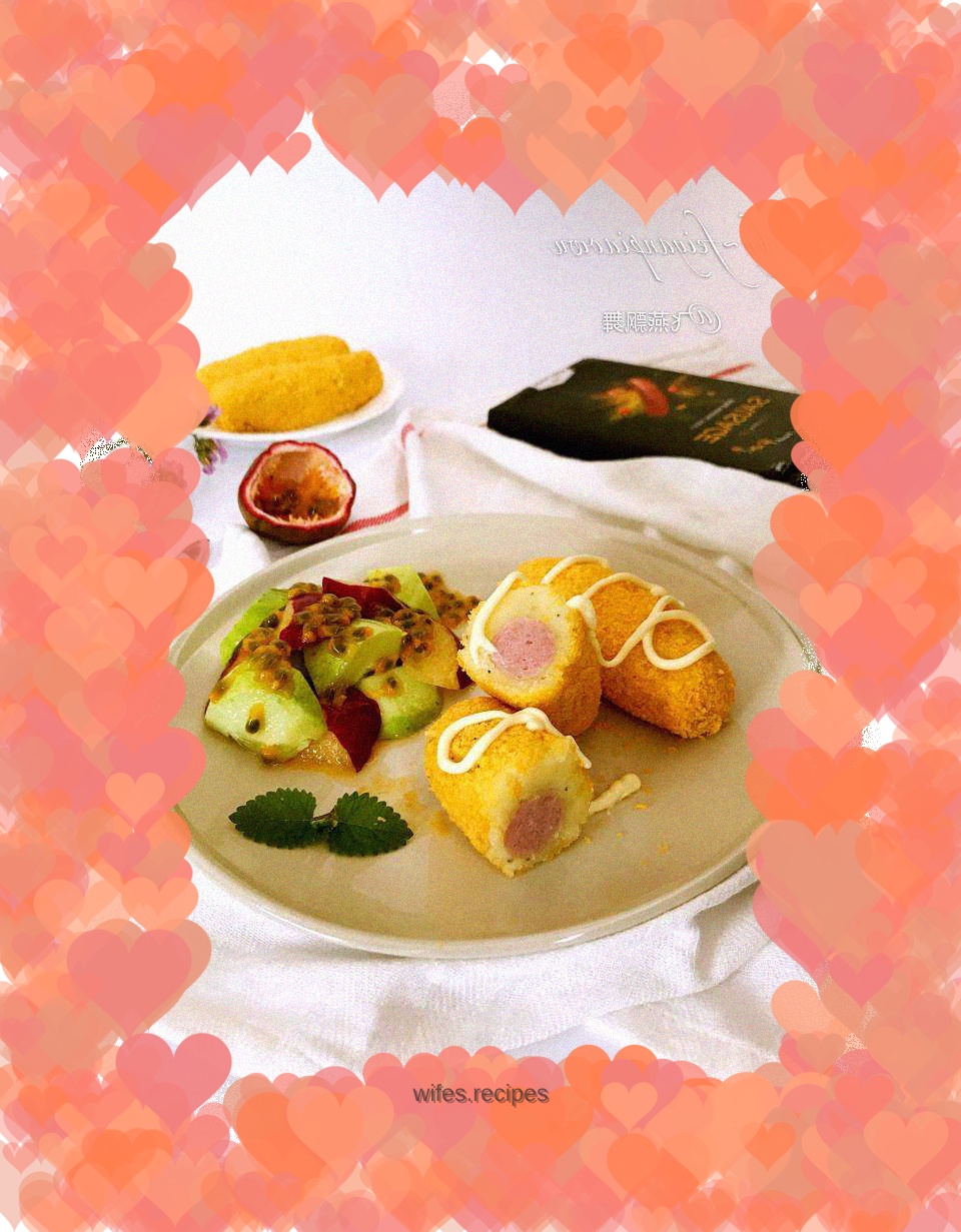 Sausage and potato sticks with vegetable and fruit salad