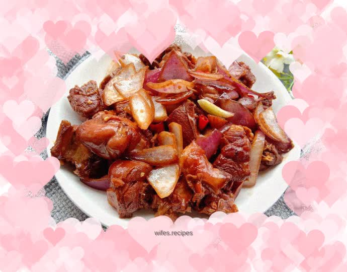 Fried dried duck legs with onions